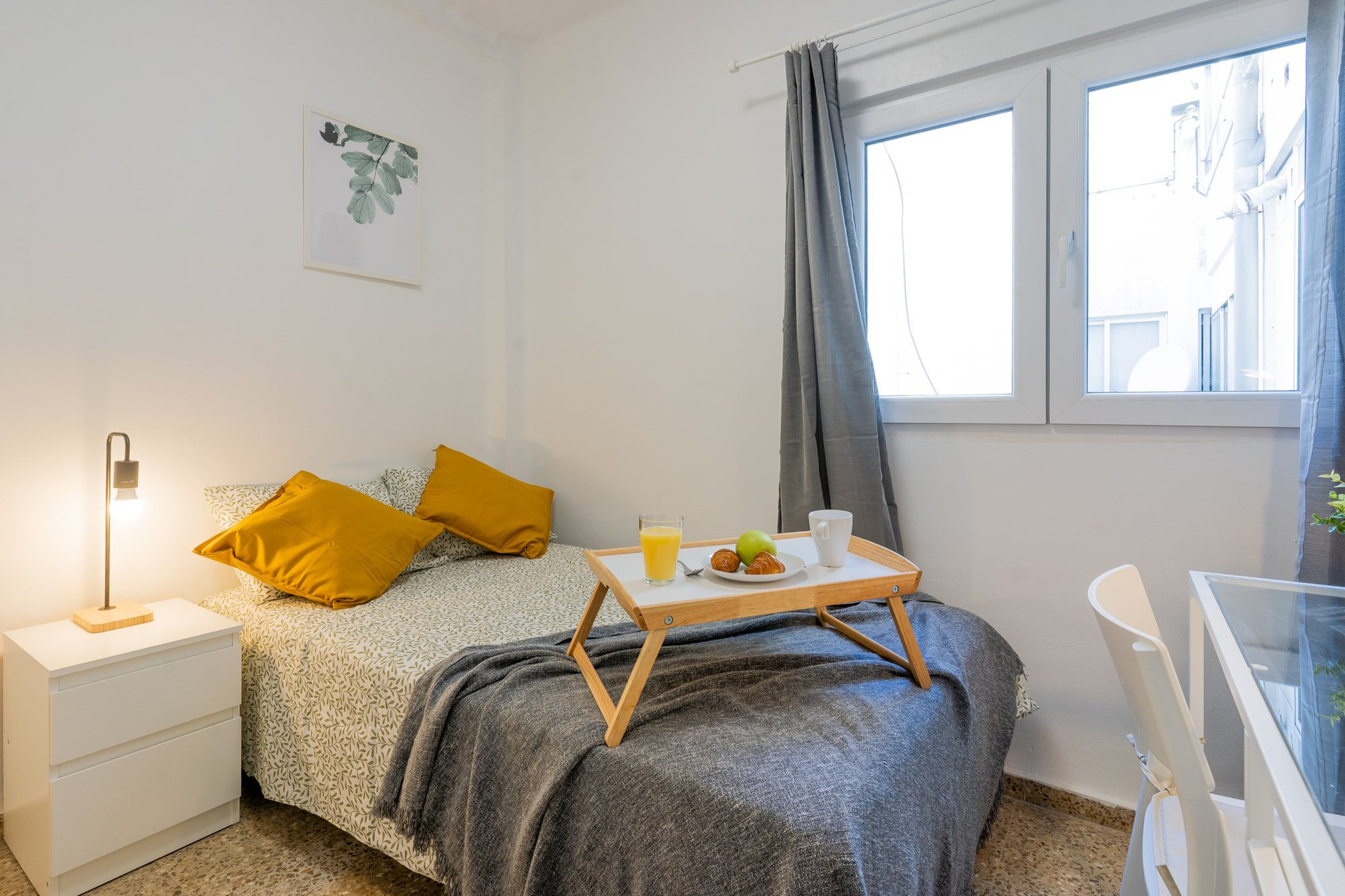 Bright bedroom with single bed