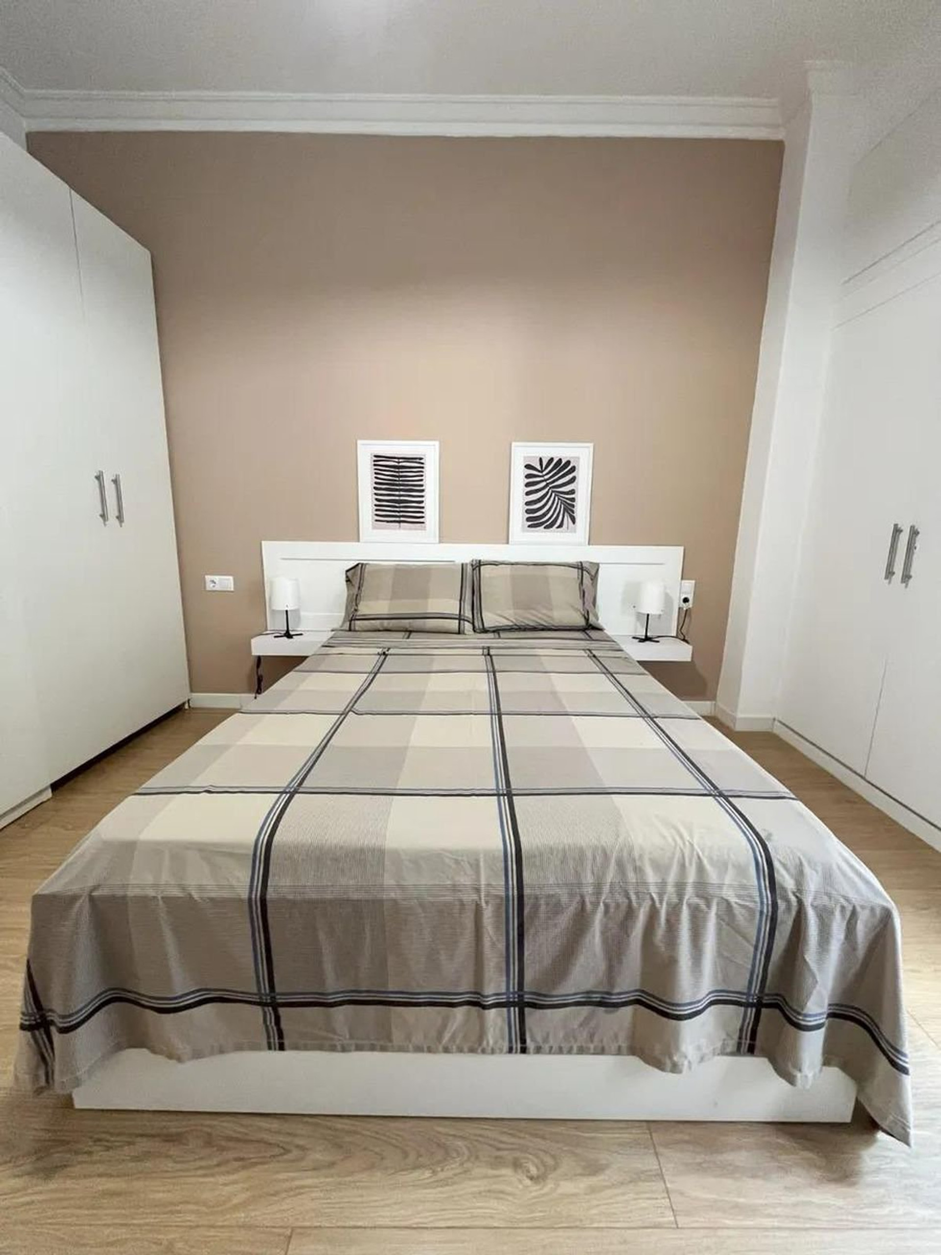 Bedroom with double bed, wardrobes