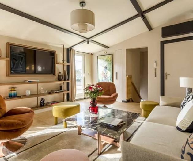 Sunlit living room with shelving