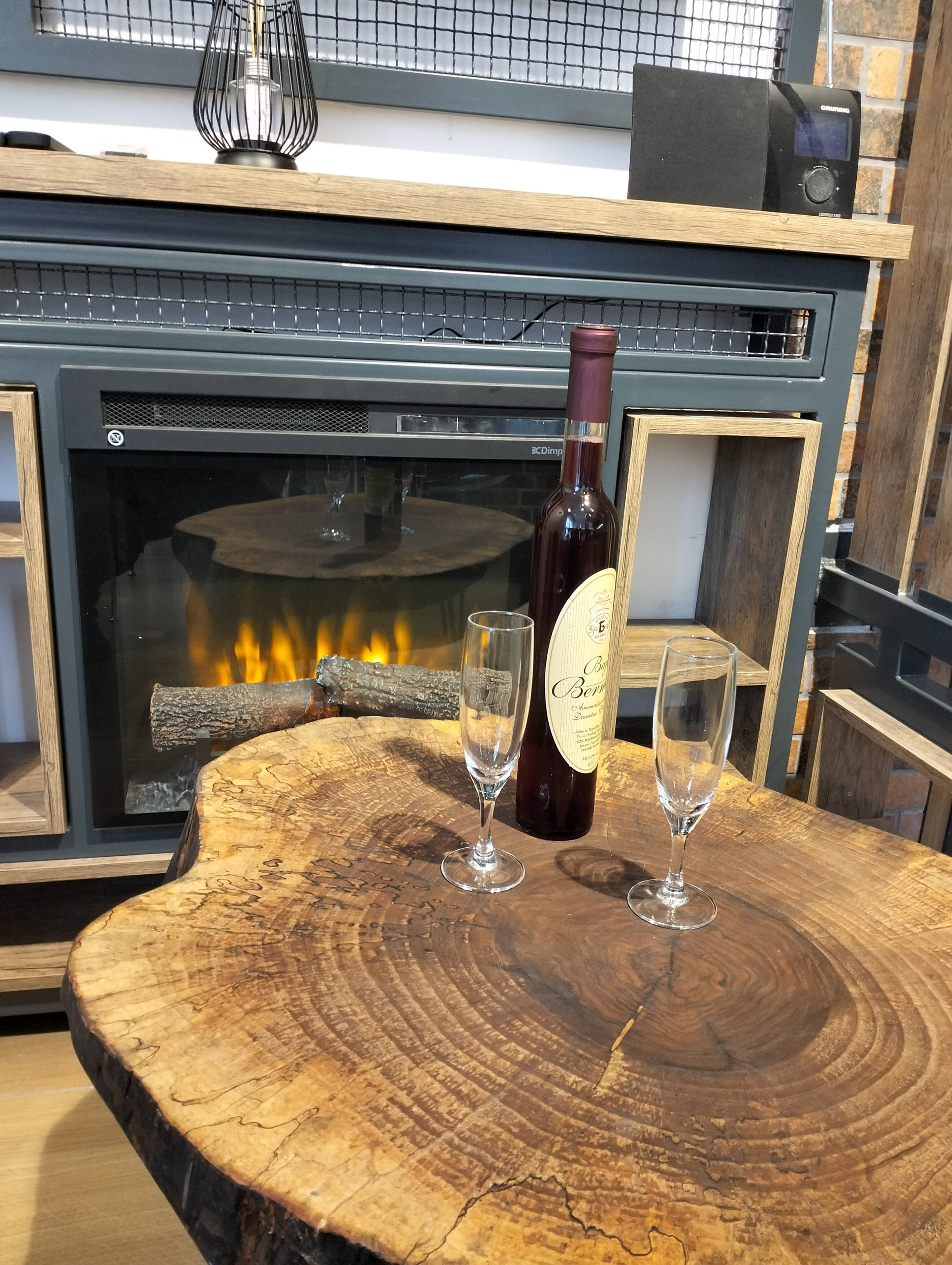Cozy fireplace with wine table setting