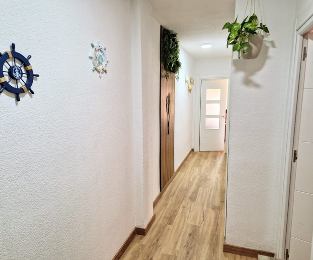 Hallway with decor and doors
