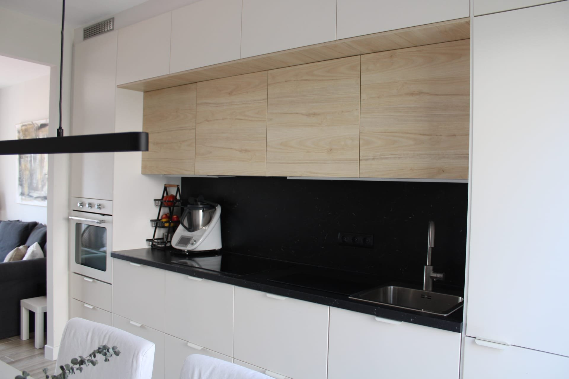 Modern kitchen with black countertop