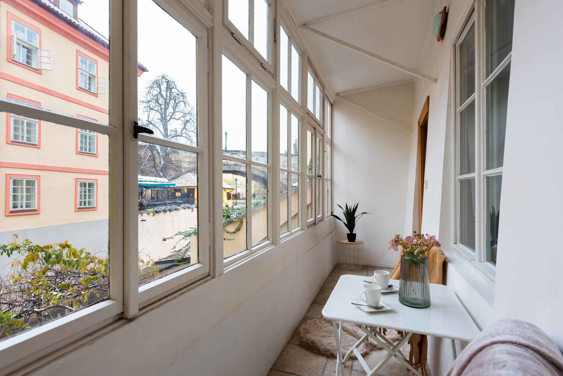 Enclosed balcony with seating table