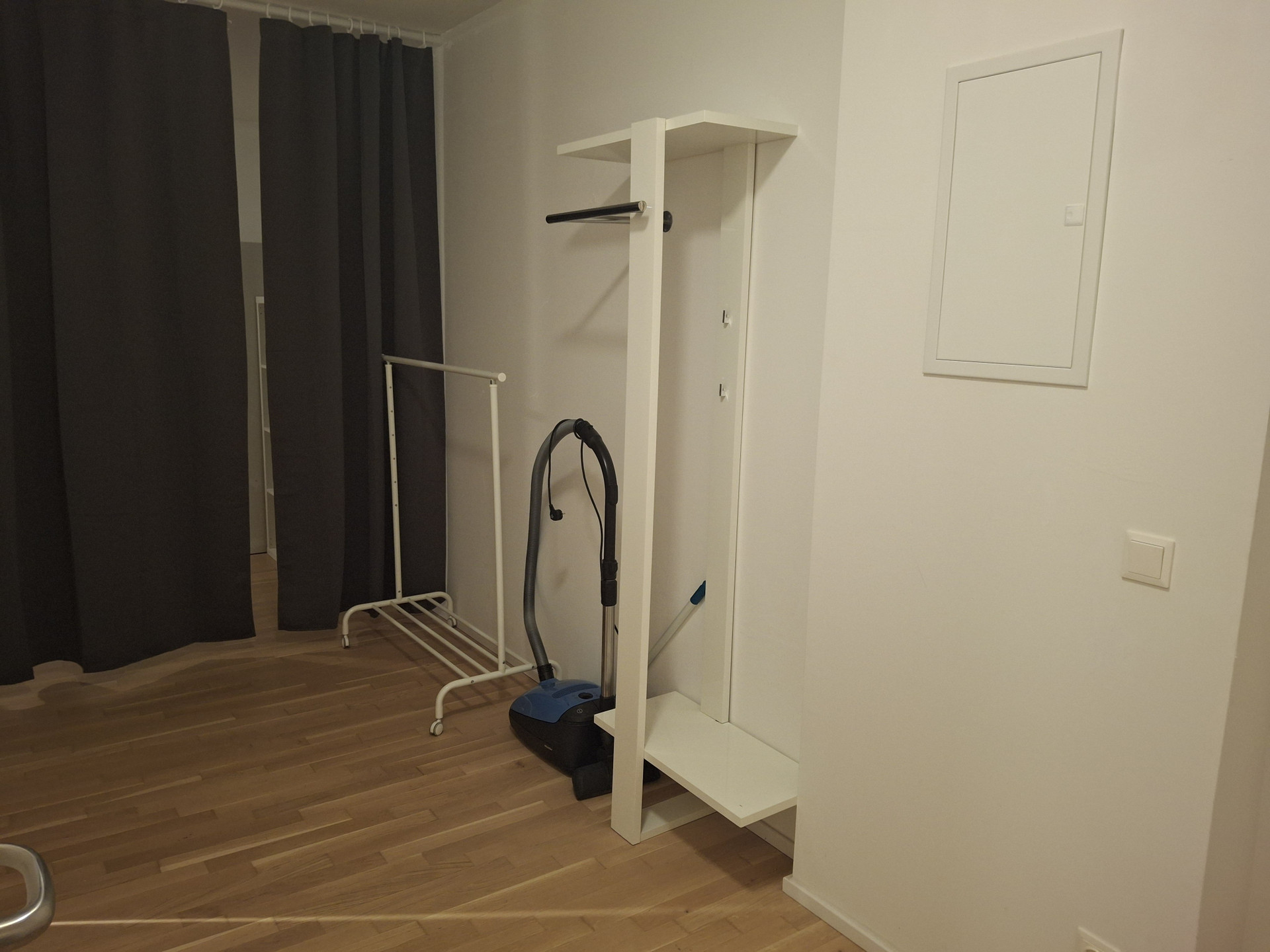 Storage area with clothing rack