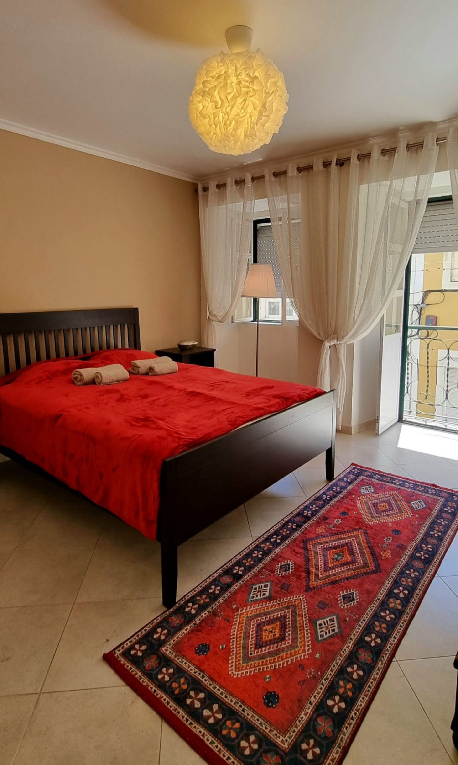 The main double bedroom with a balcony
