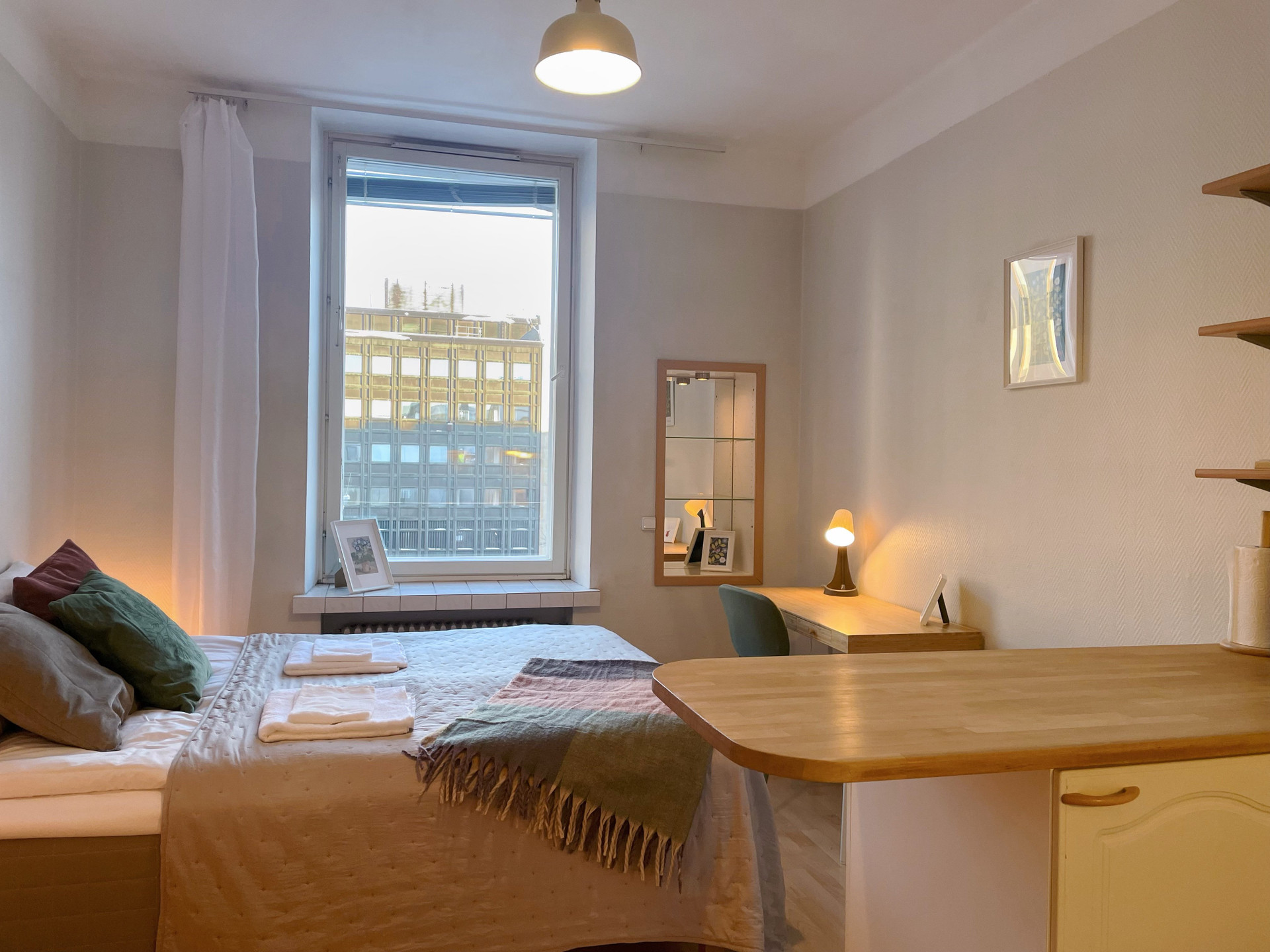 Bedroom with large city window