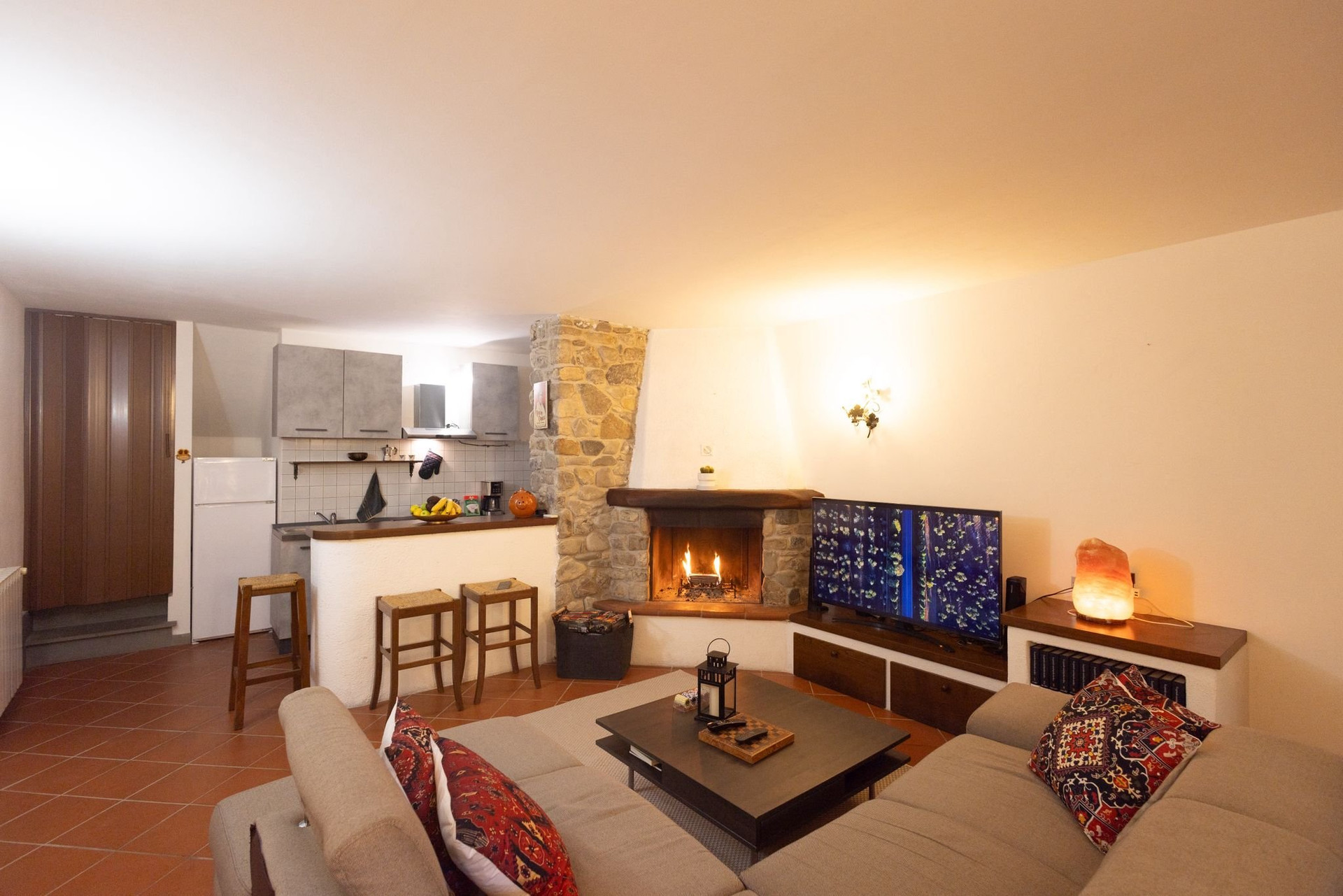 Living room sofa fireplace kitchen
