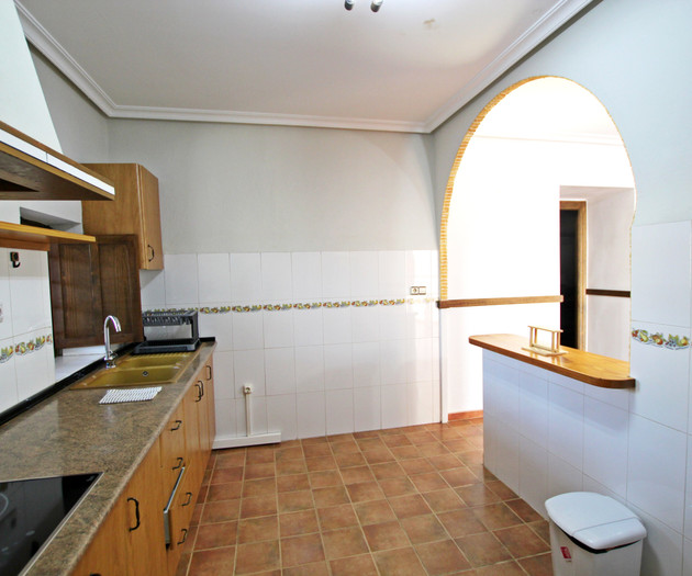 Kitchen with arched doorway