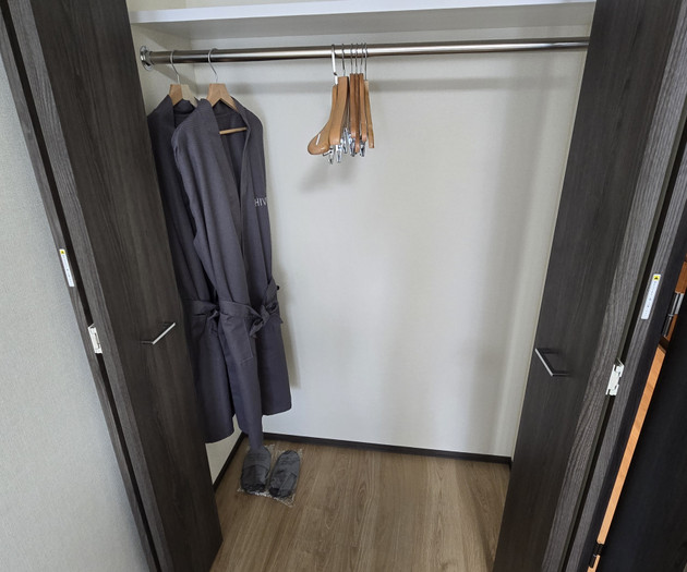 Closet with robes and hangers