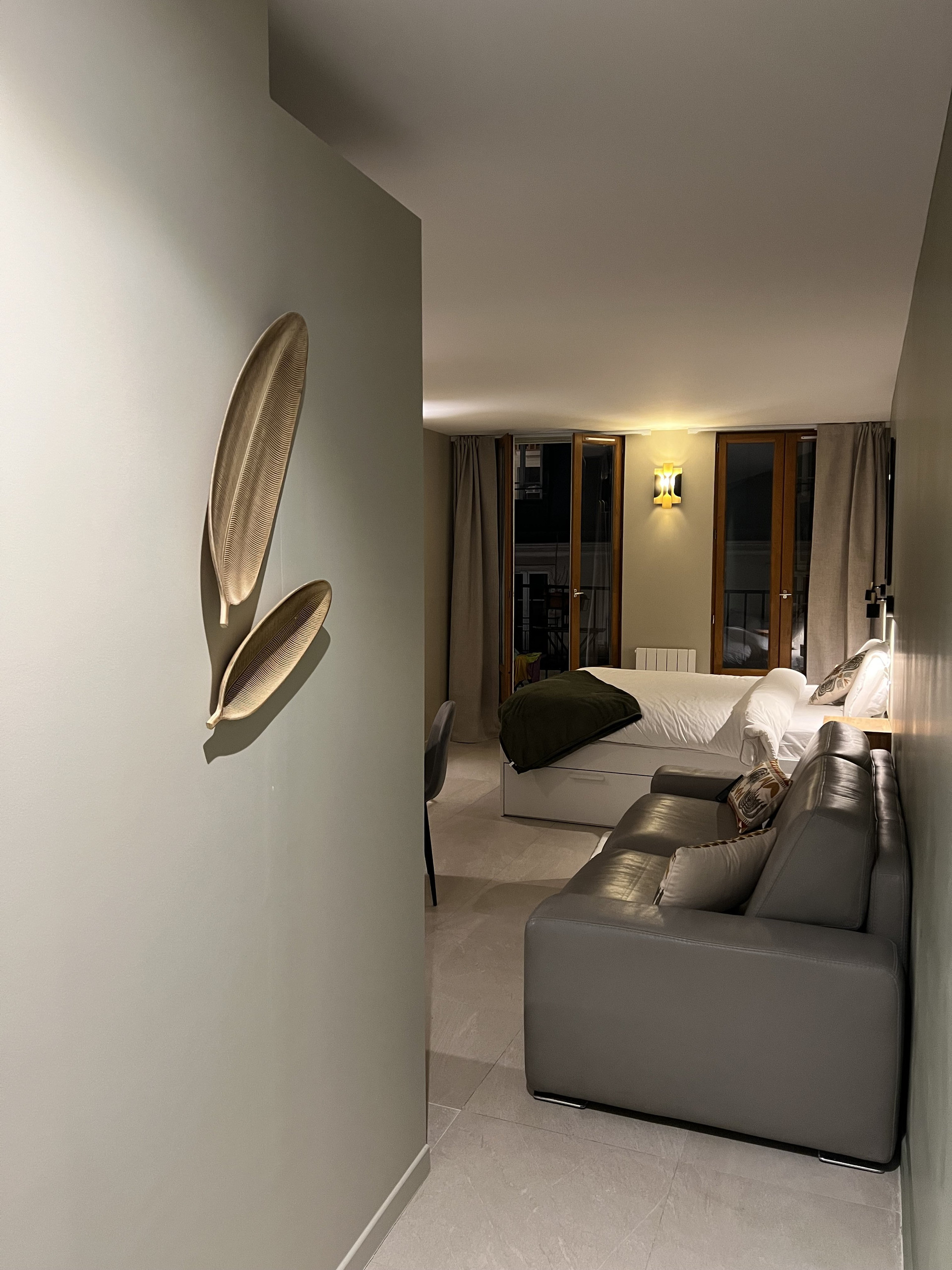 Hallway entry with feather wall art