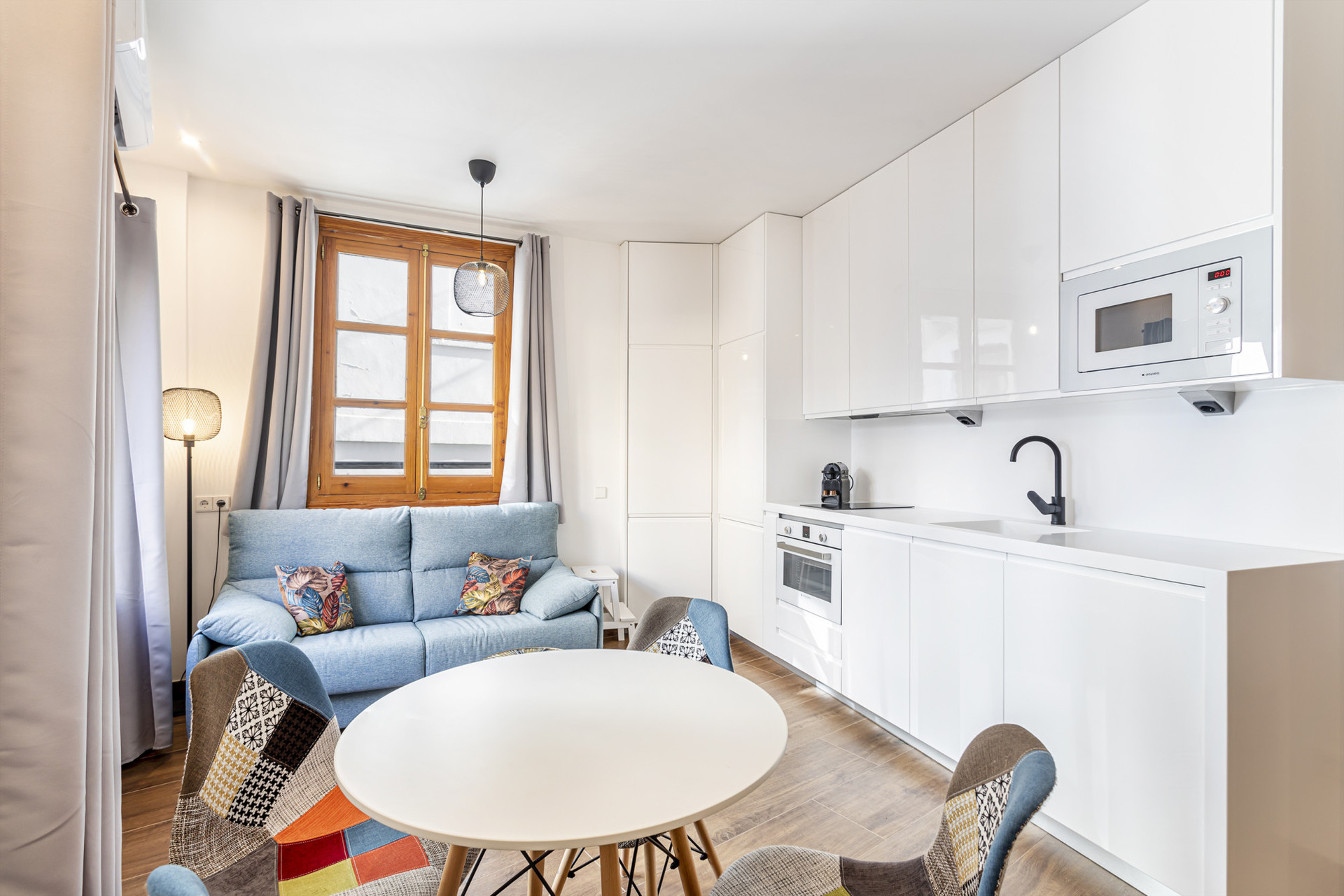 Bright open concept kitchen living room area.