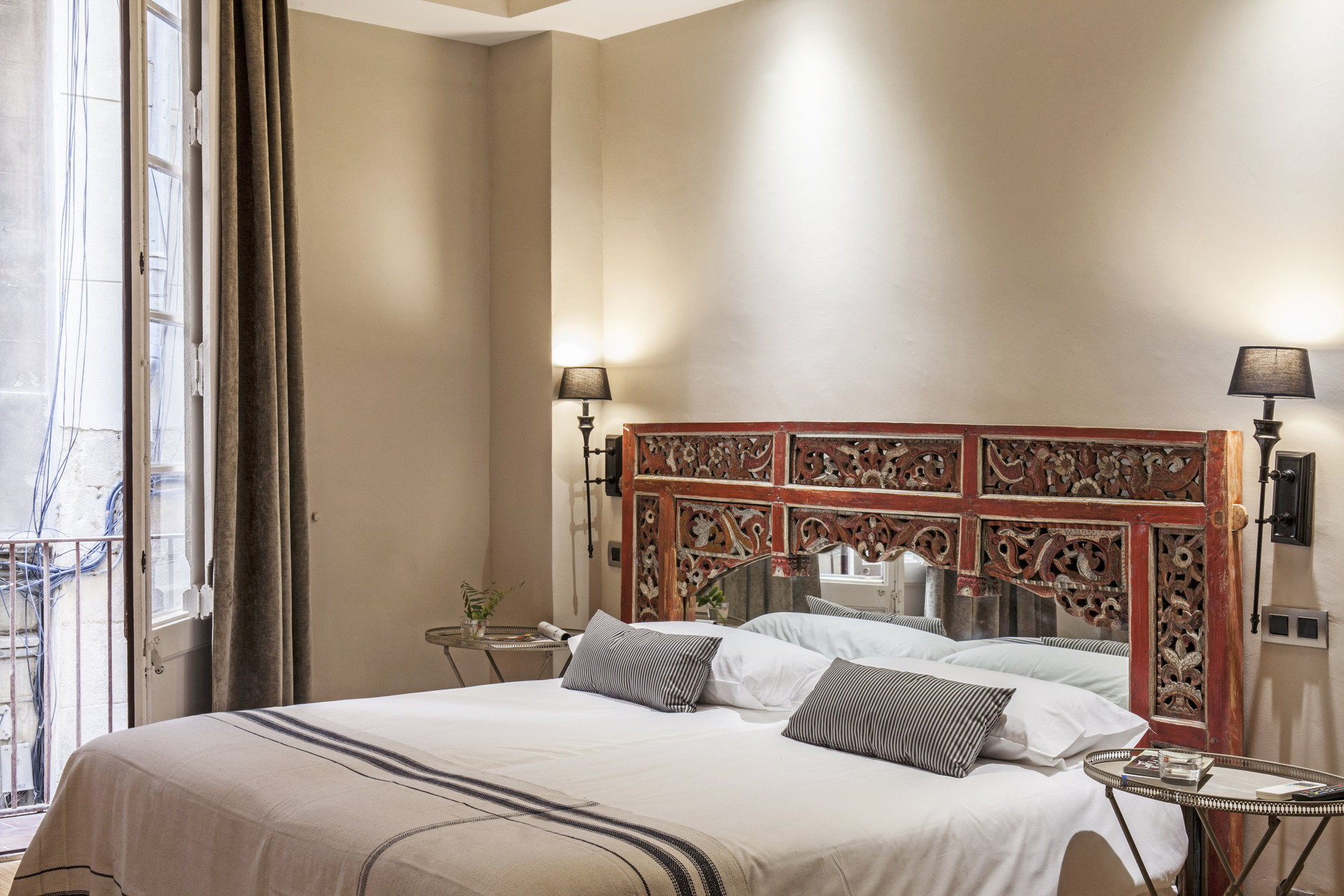 Double bed with carved red headboard