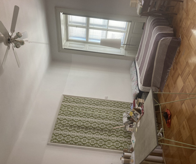 Bedroom with bed and rug