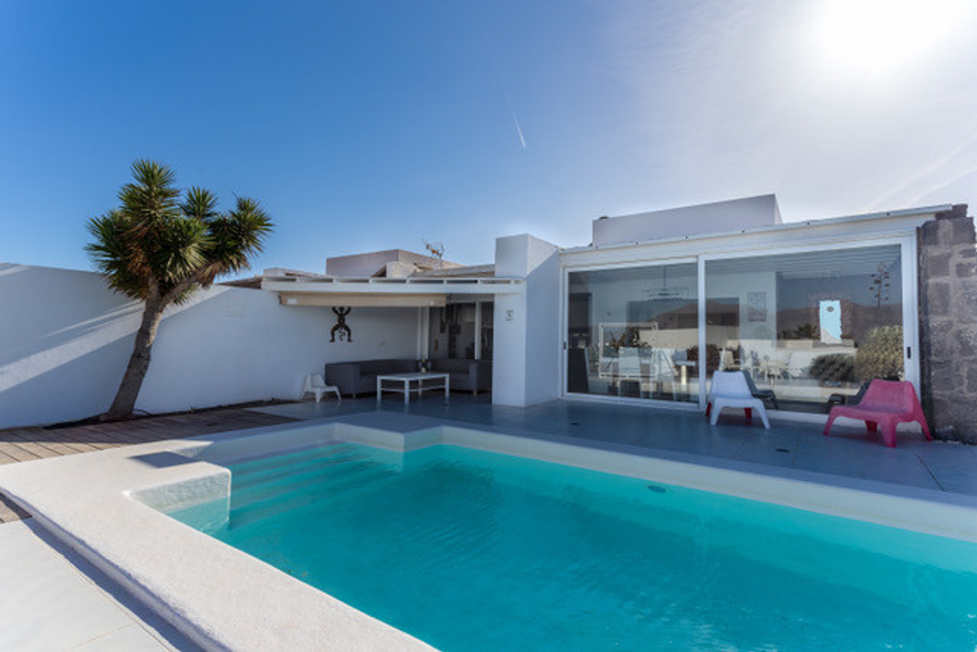 Leaving the kitchen you have an outside sofa area. 