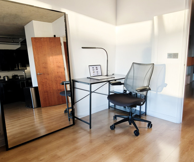 Desk workspace with large mirror