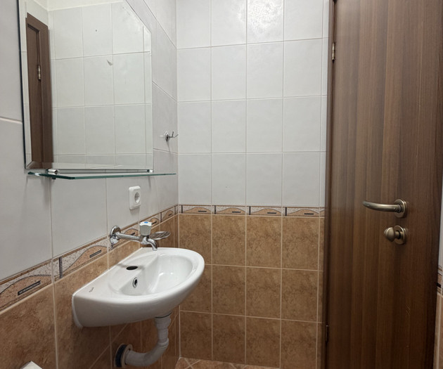 Guest toilet with corner sink