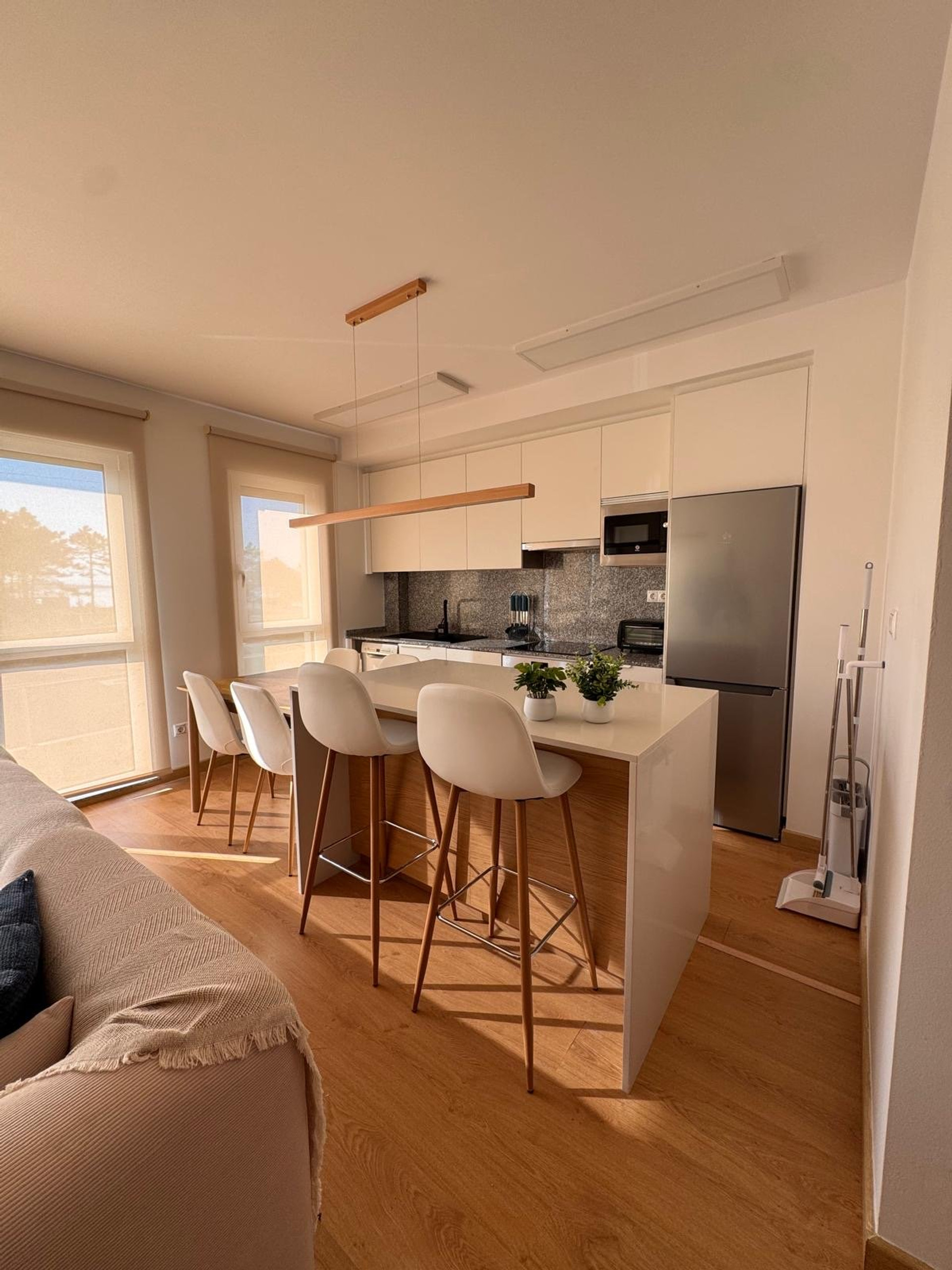 Kitchen with island and barstools