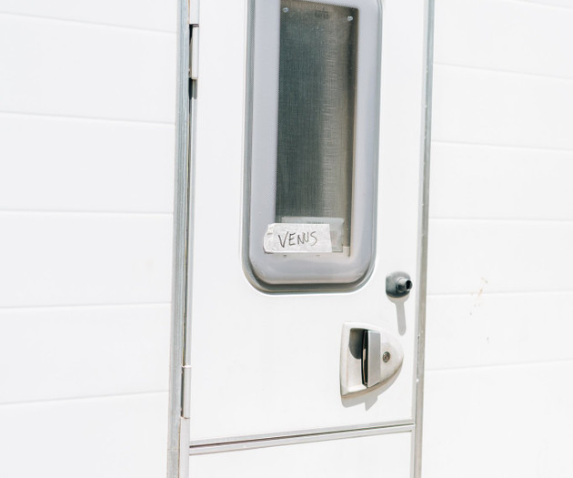 Caravan exterior door labeled Venus