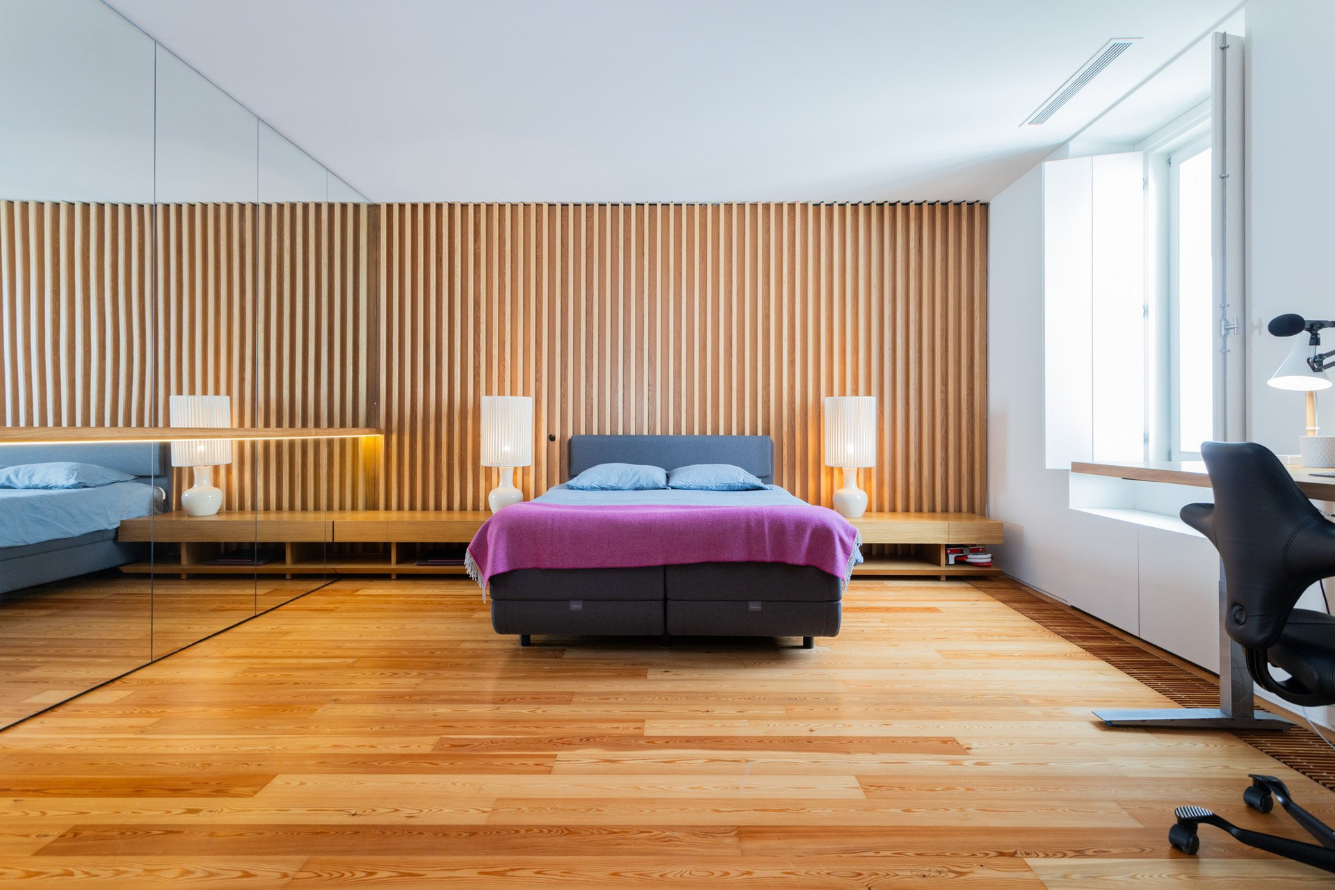 Bedroom with wood slat wall