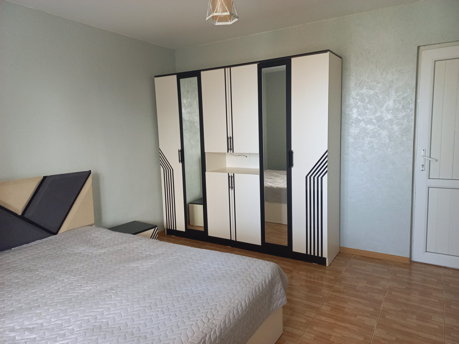 Bedroom with wardrobe and double bed