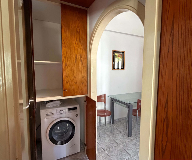 Washing machine in storage closet