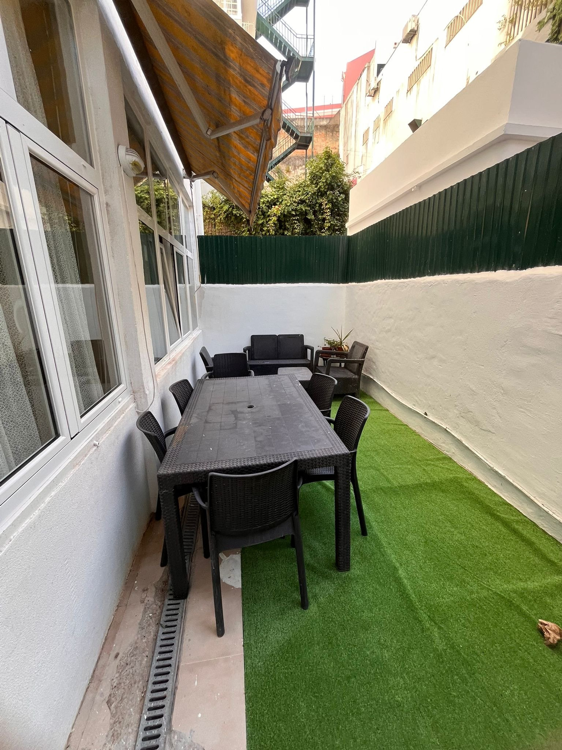 Outdoor dining table with awning