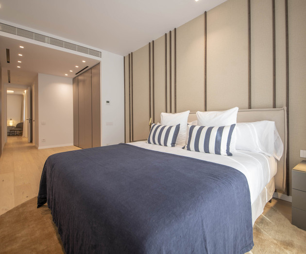 Bedroom with navy bedspread