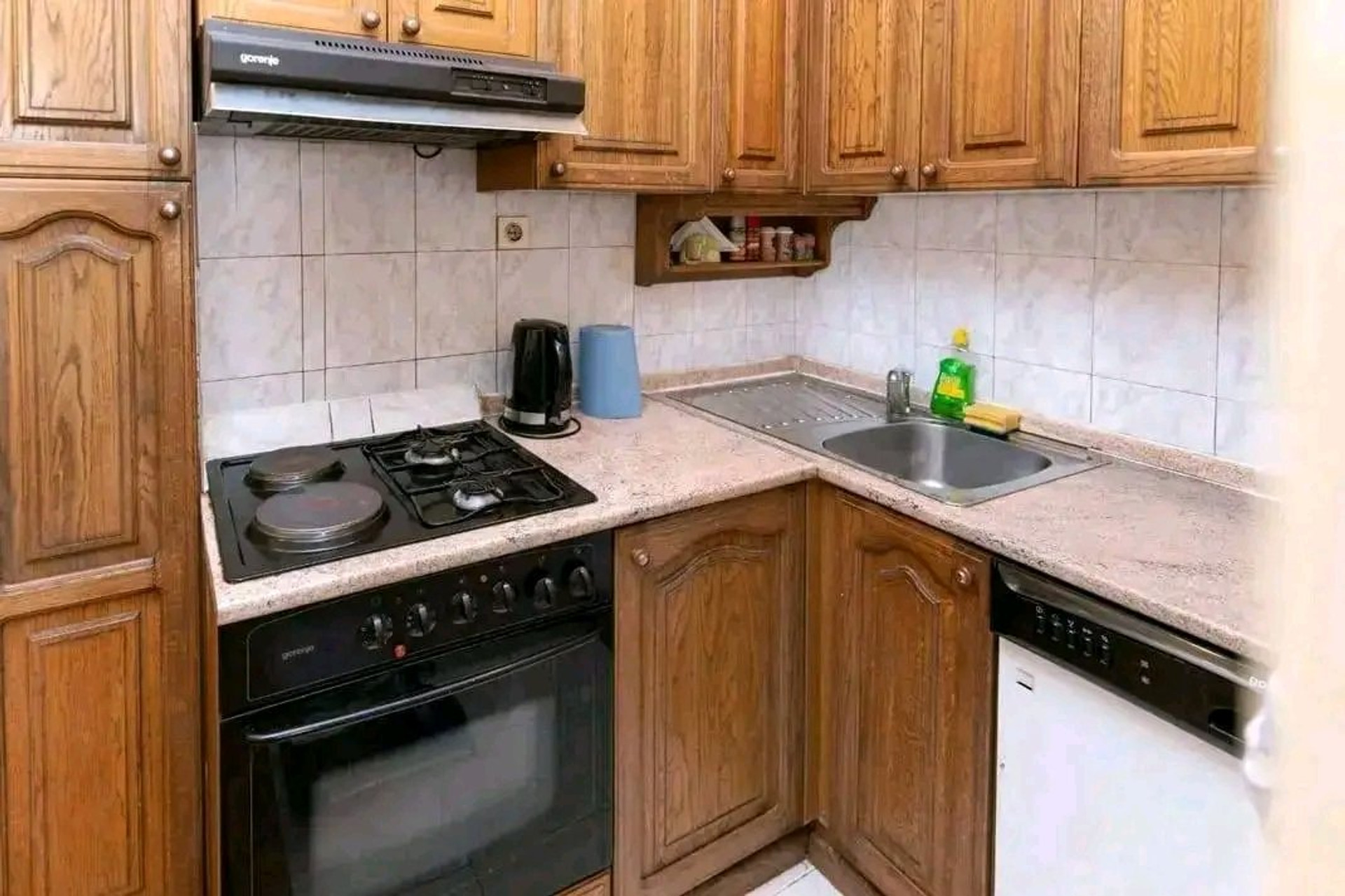 Kitchen with stove and sink
