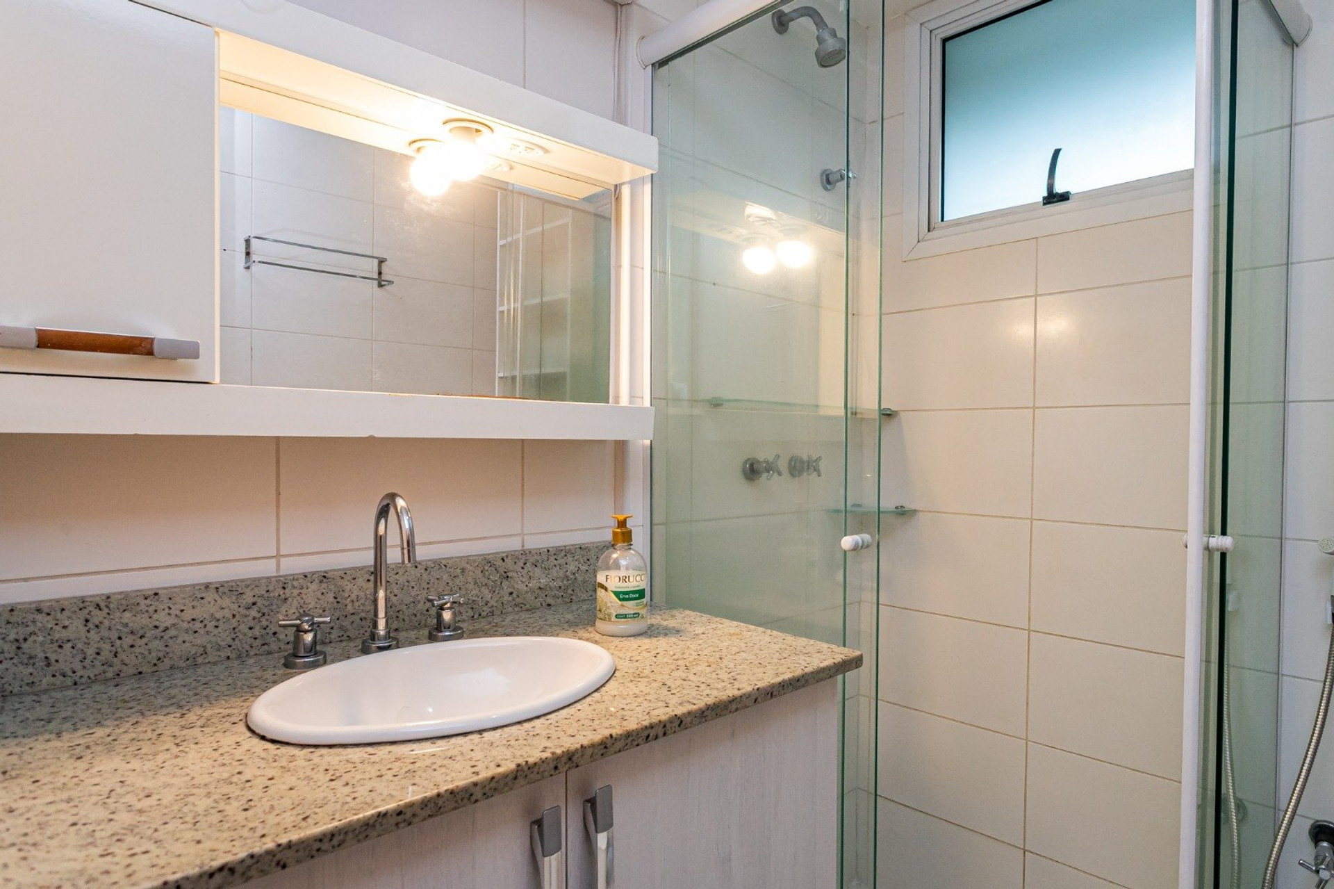Bathroom with granite vanity and shower