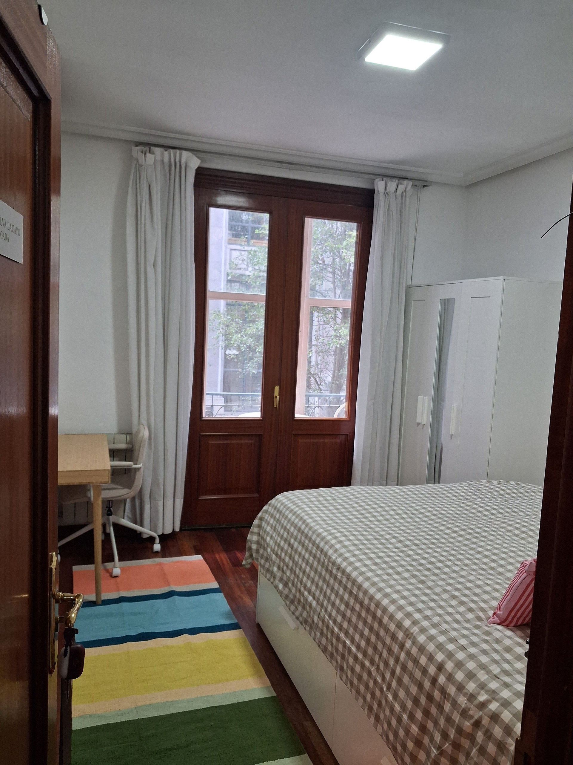 Bedroom with French window and desk