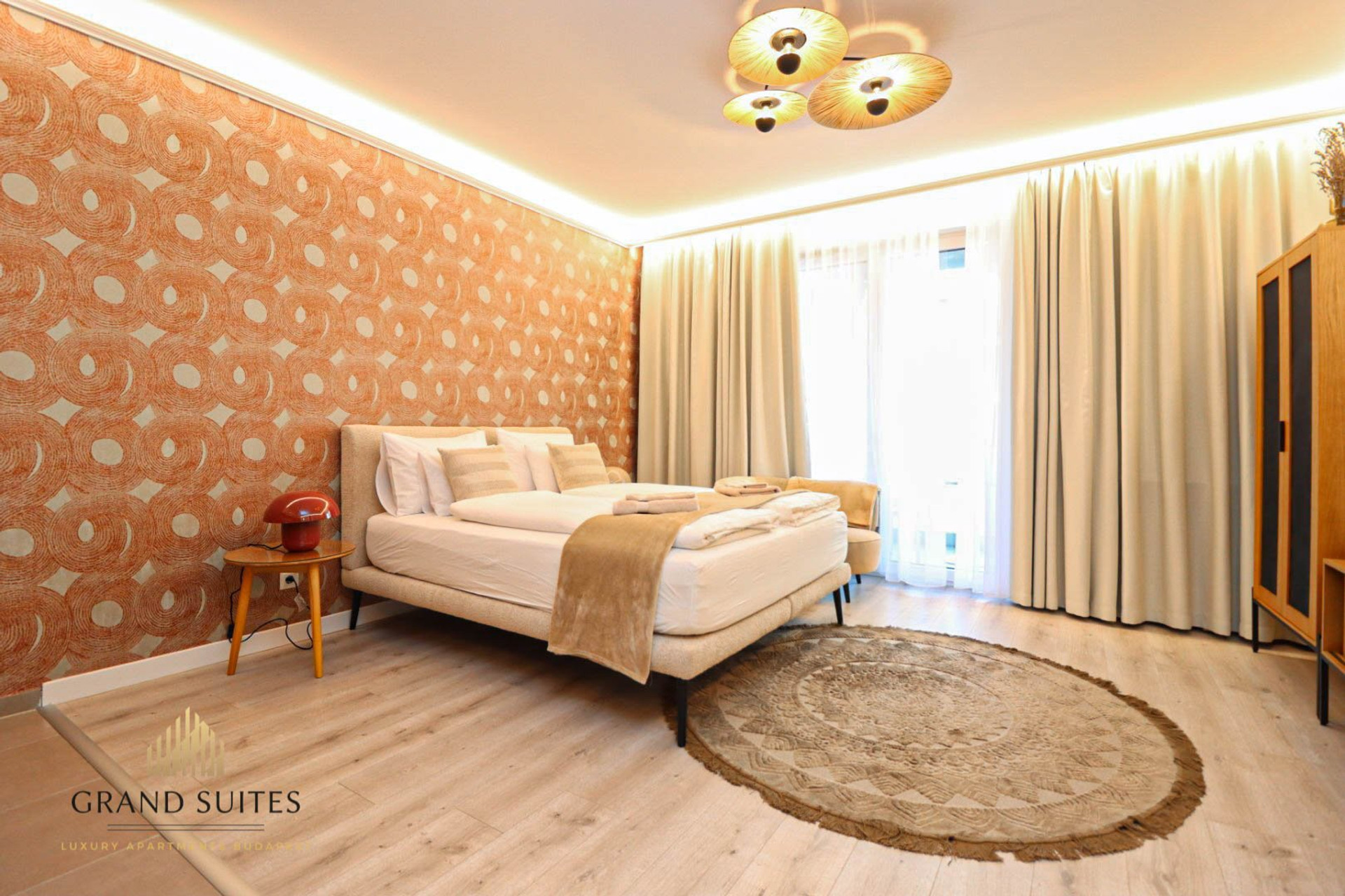 Stylish bedroom with feature wallpaper