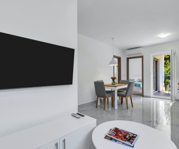 Living room with TV and dining