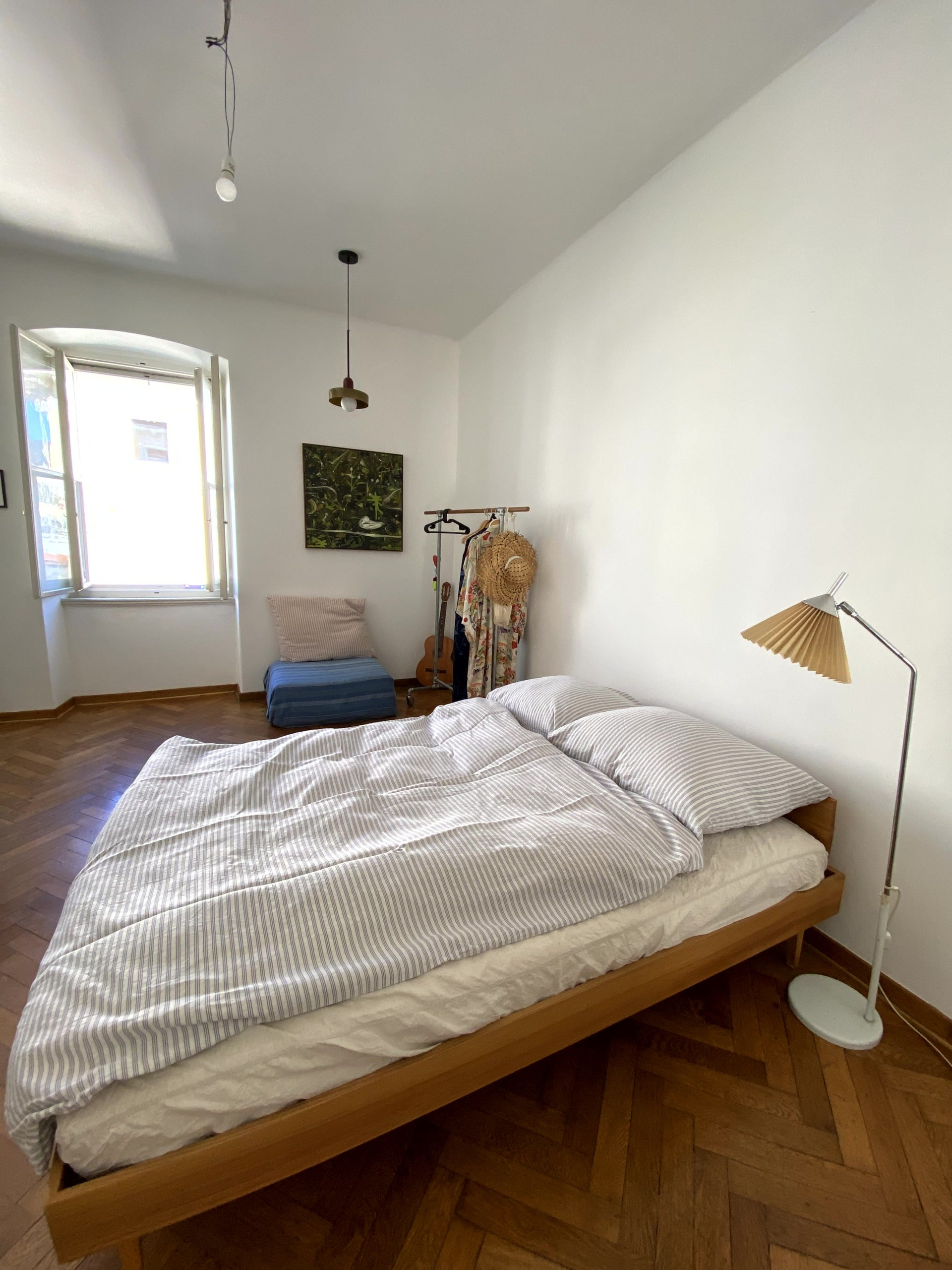 Bright bedroom with parquet floors