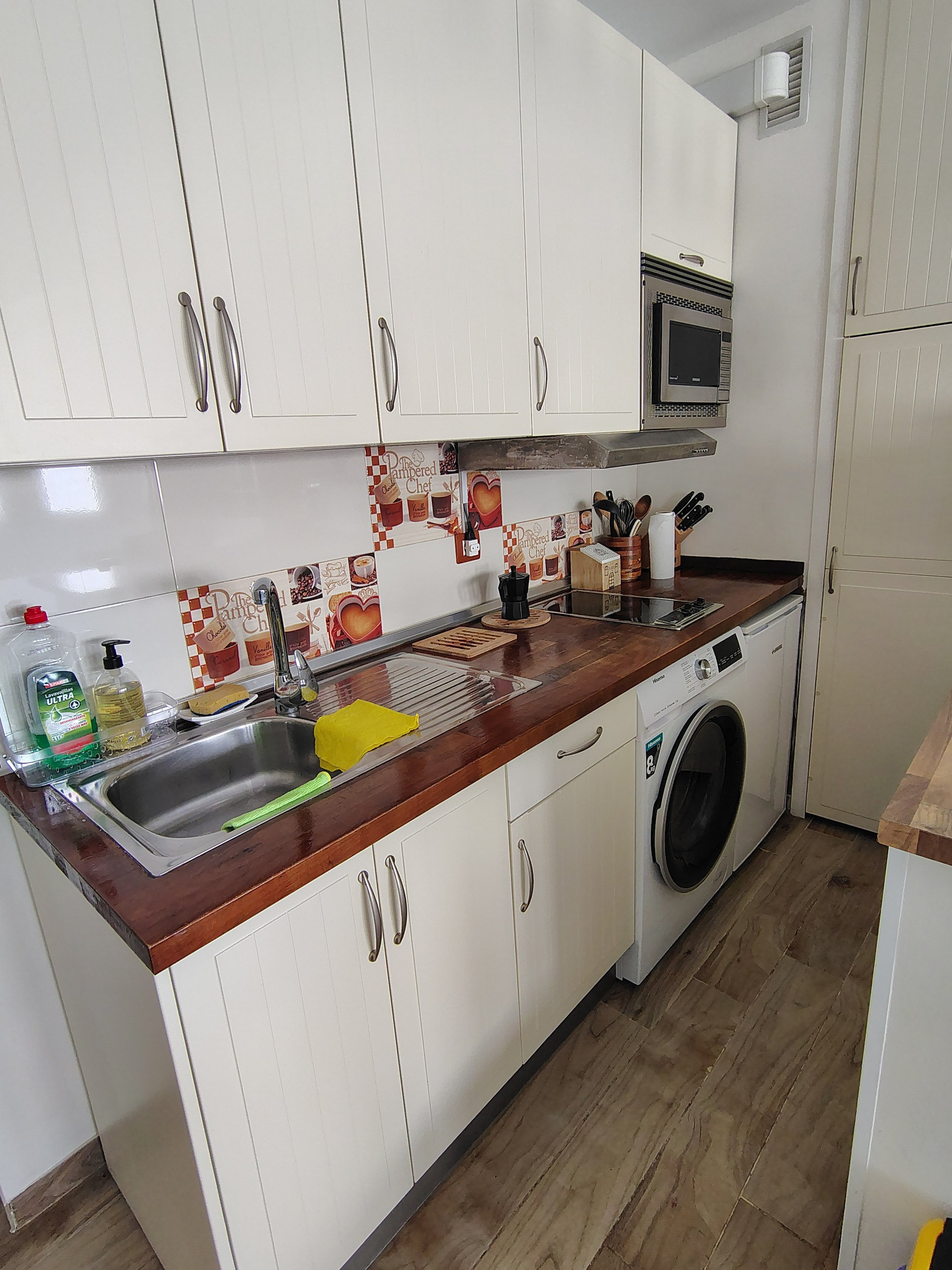 White kitchen with sink and hob