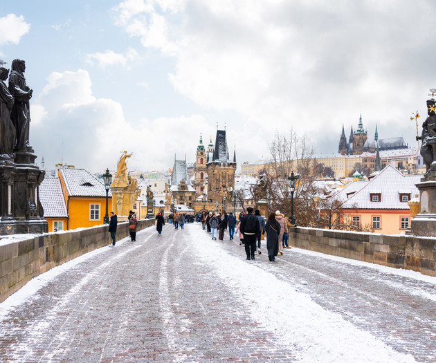 Snowy Charles Bridge with statues