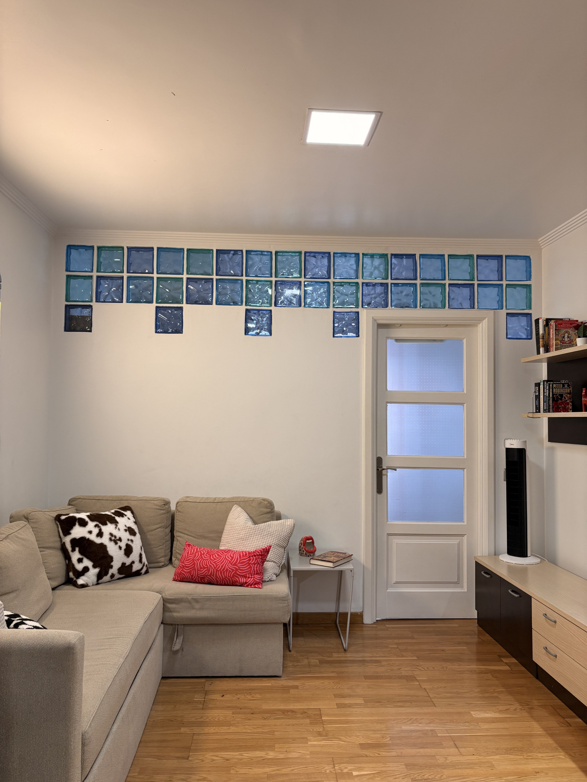 Living room with glass block wall
