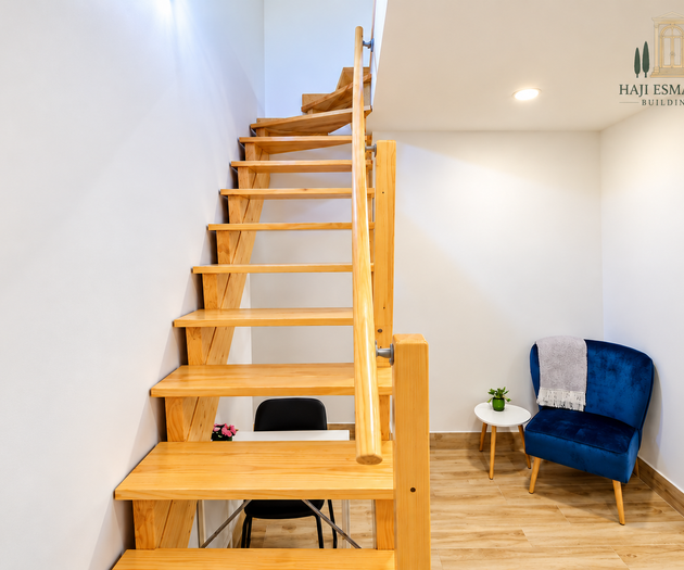 Staircase with blue armchair