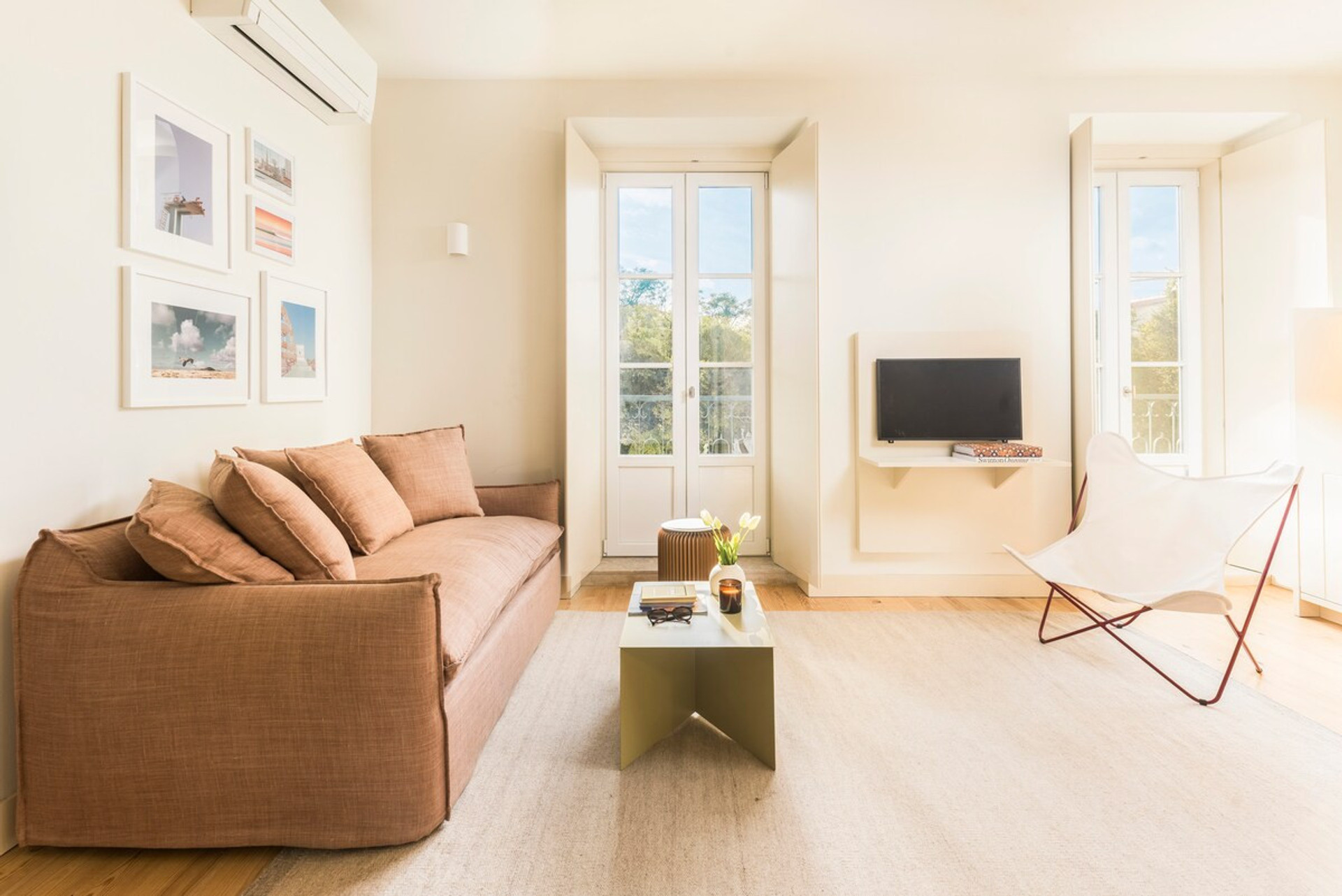 Spacious and bright living room with large windows and plenty of light.