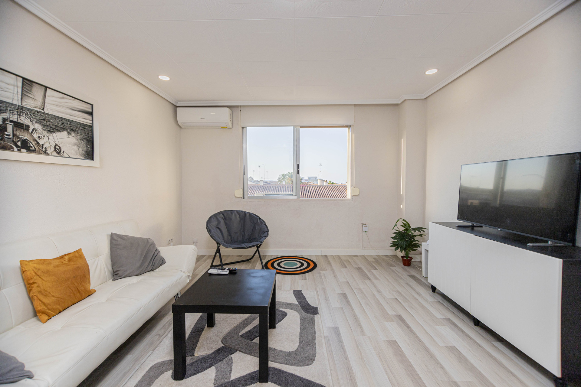 Living area with TV and window