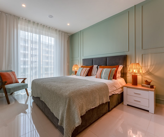 Green accent wall bedroom