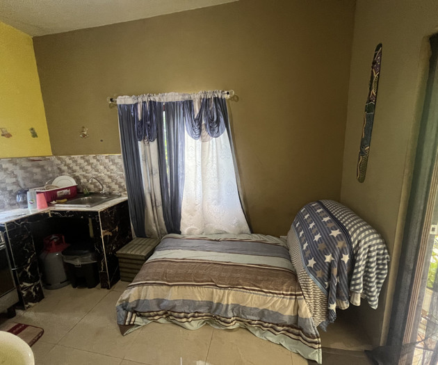 Compact kitchenette with twin bed