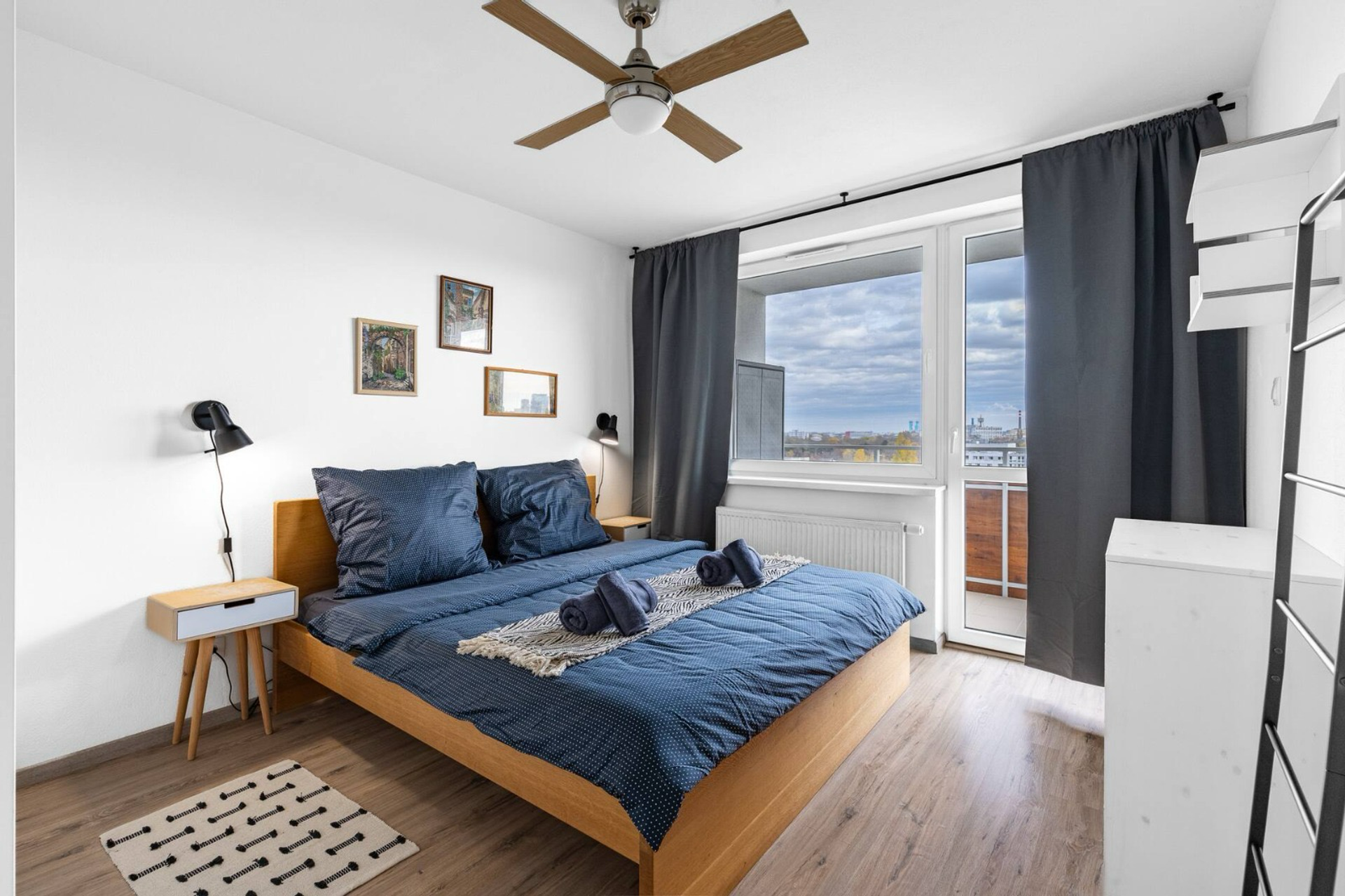 Bedroom with balcony access and city view