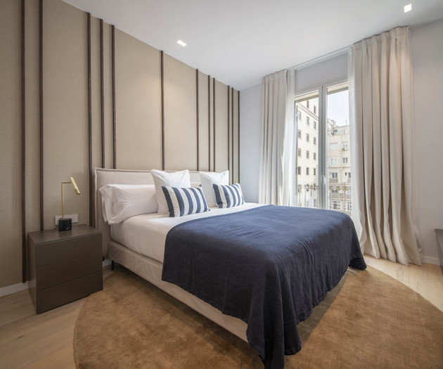 Bedroom with balcony window