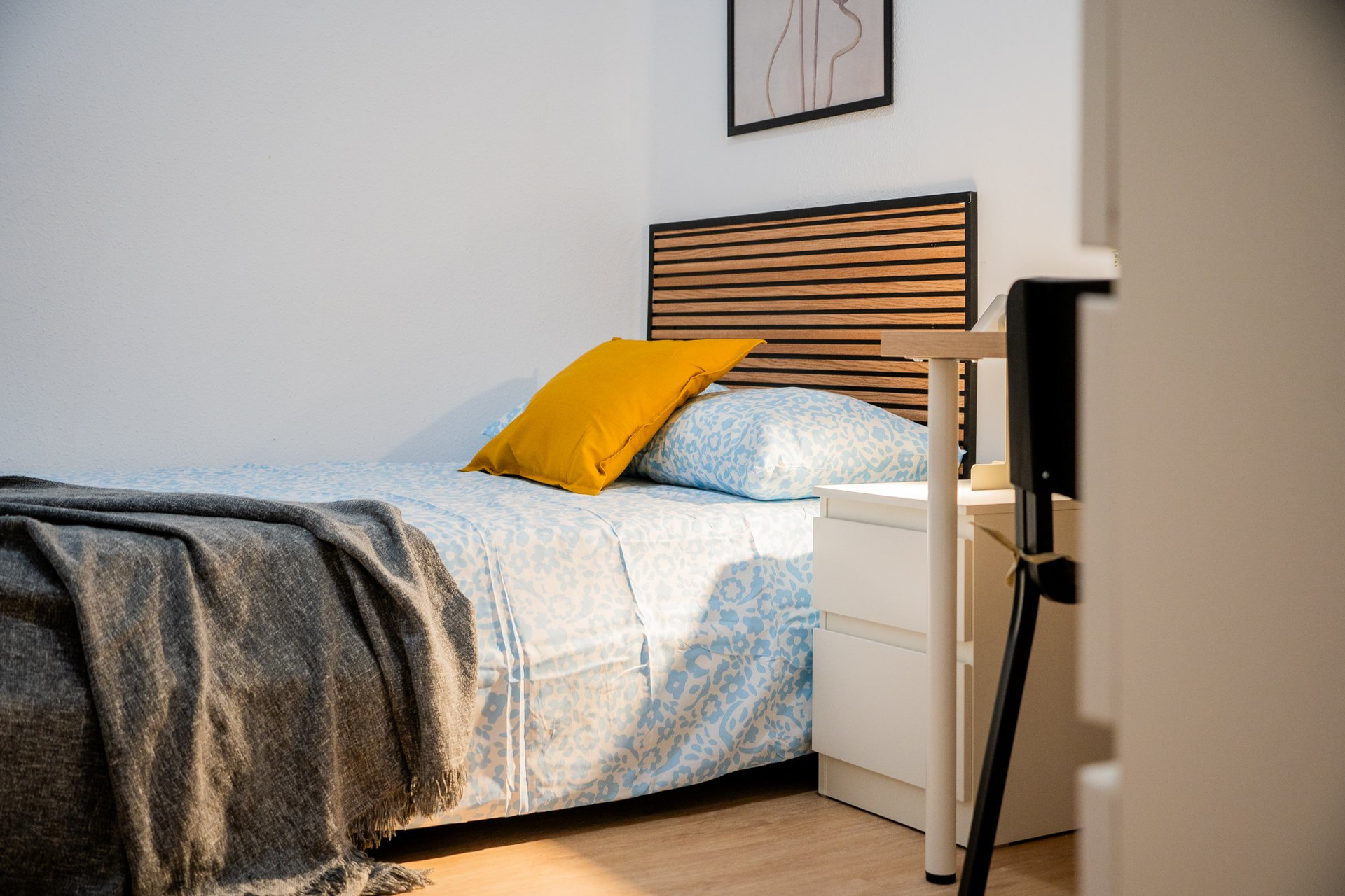 Single bed with yellow pillow
