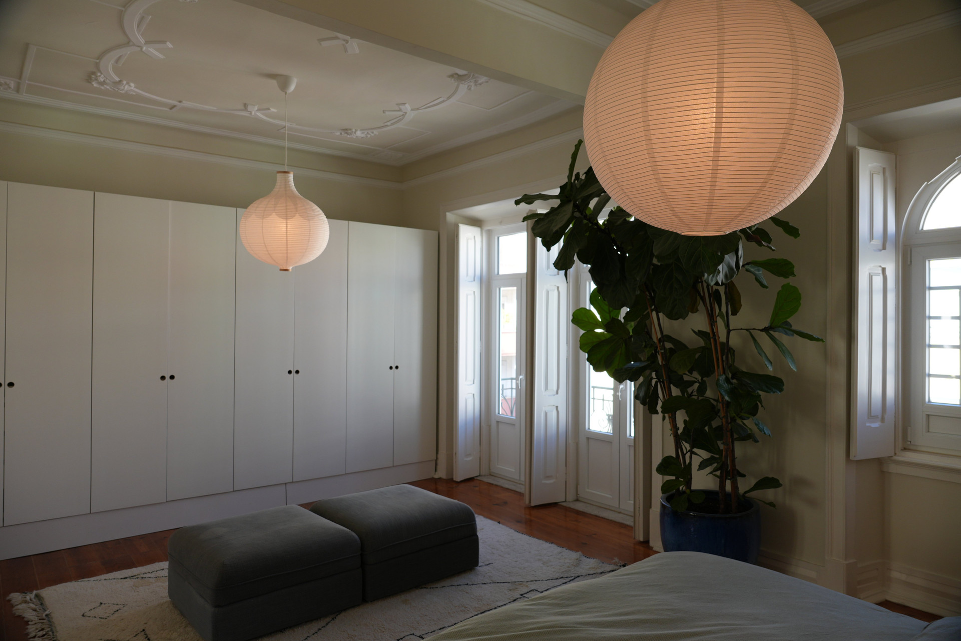 Bedroom with wardrobes and balcony doors