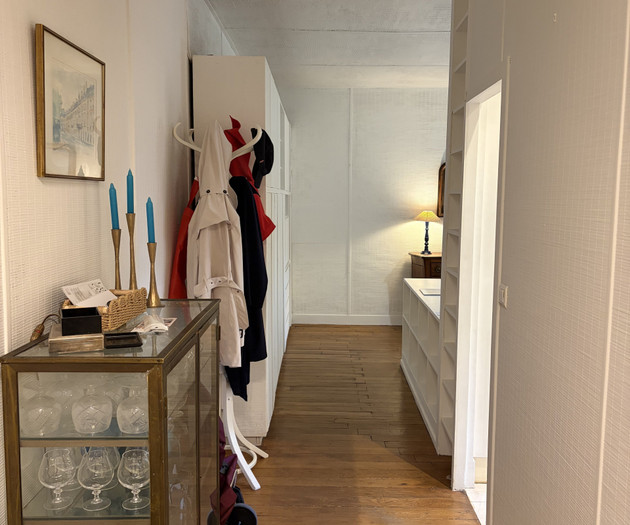 Hallway with vintage cabinet and coat rack