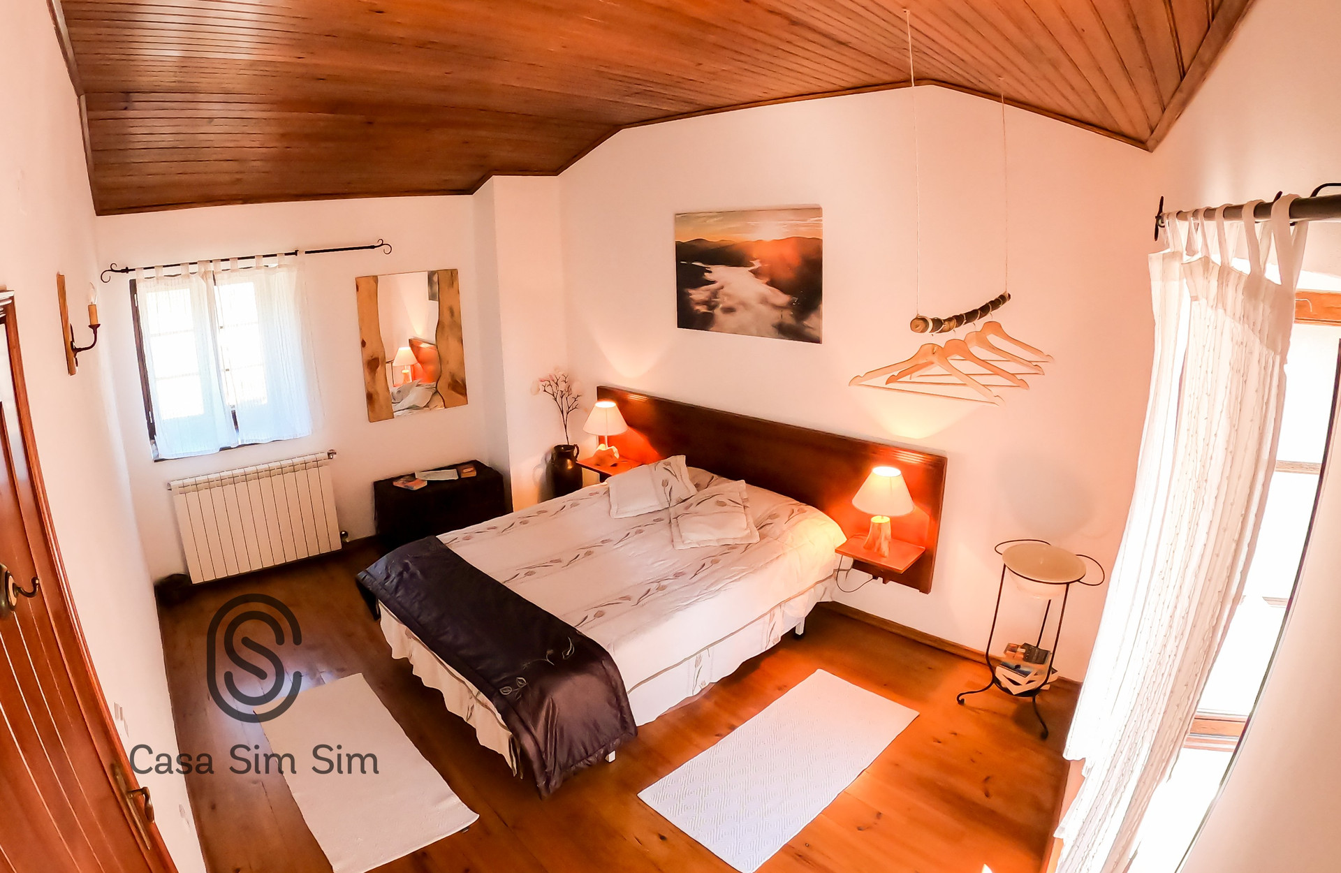 Master bedroom double bed wood floor
