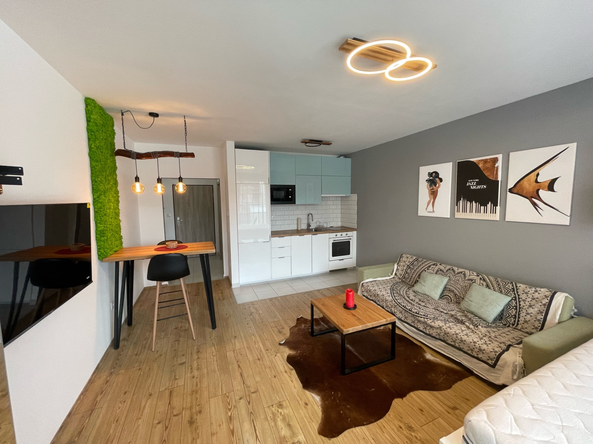 studio with 127 cm QLED tv on the left