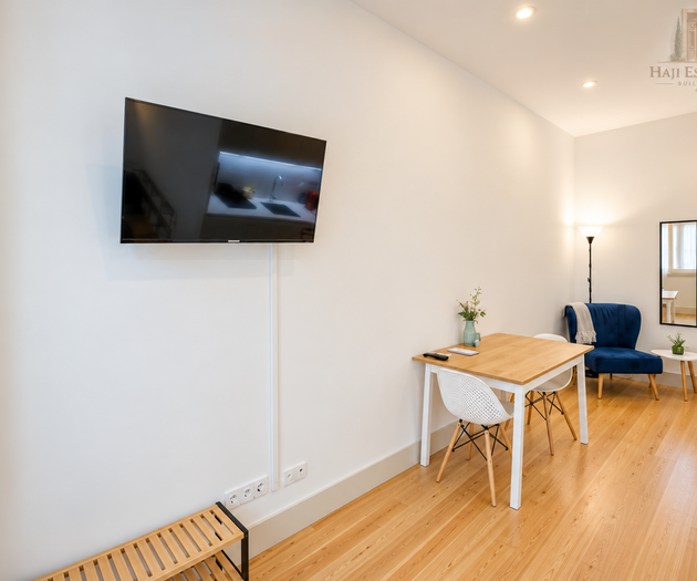 Dining area with TV and armchair