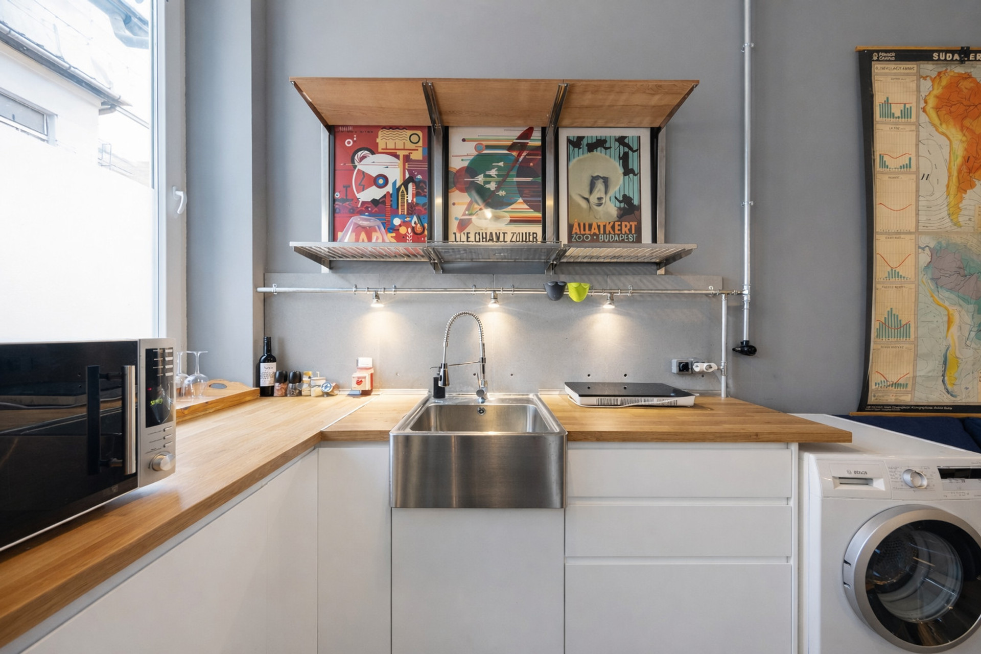 Kitchen with double induction stove, in-built fridge and washing machine